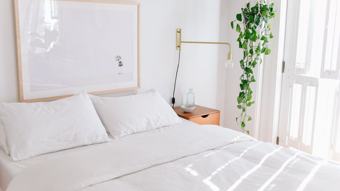 | A bed with white Brooklinen sheets on it