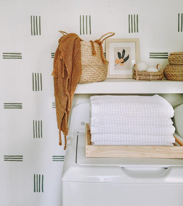 Stack of white waffle towels on a shelf