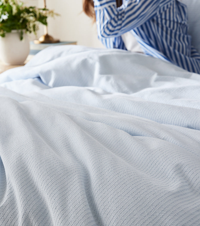 A bed made up with our Textured Stripe Duvet Set