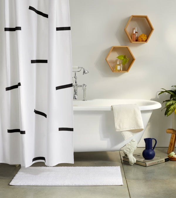White bathroom with dash shower curtain