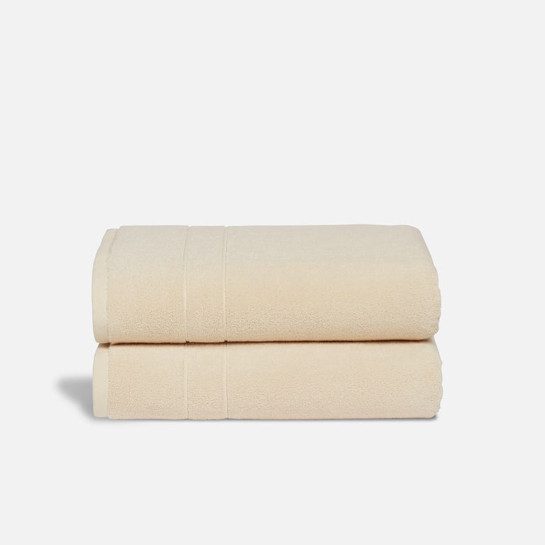 https://www.brooklinen.com/cdn/shop/products/BKL_22-10_Bath_SuperPlush_BathTowel_Vanilla_1x_WOgrey_768x.progressive.jpg?v=1695314309